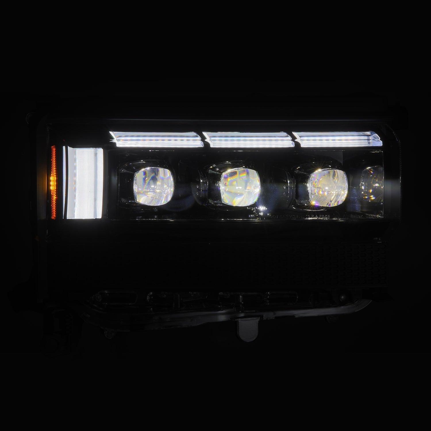 AlphaRex NOVA-Series Black LED projector headlights illuminated on Toyota Land Cruiser